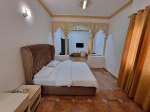 Voodi või voodid majutusasutuse Marhabaa hotel Al Amarat toas