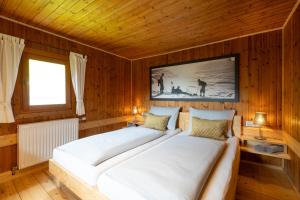 A bed or beds in a room at Chalet Kasern