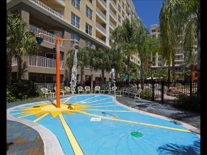 a swimming pool with a fountain in front of a building at Holiday Homes 1 Room 2 Bed 1 Bathroom 4 Occupants in Orlando