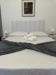 Кровать или кровати в номере Suíte no Jardim Botânico