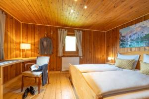 A bed or beds in a room at Chalet Kasern