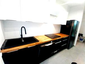 a kitchen with a sink and a counter top at Dom Bilardowy przy trasie A4 Gliwice Żernica 110m2 