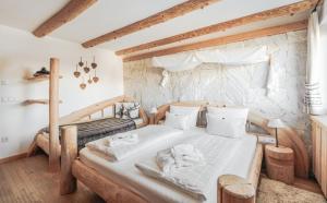 Postel nebo postele na pokoji v ubytování Hotel Piz Seteur
