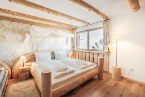 Postel nebo postele na pokoji v ubytování Hotel Piz Seteur