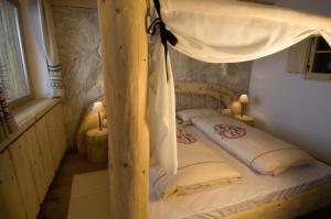 Postel nebo postele na pokoji v ubytování Hotel Piz Seteur