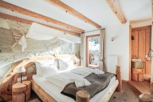 Postel nebo postele na pokoji v ubytování Hotel Piz Seteur