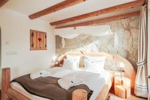 Postel nebo postele na pokoji v ubytování Hotel Piz Seteur