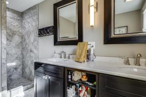 a bathroom with a sink and a shower at Elegant Saratoga Springs Stay Walk to Town, Track in Saratoga Springs +17 photos