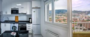 Kuchyň nebo kuchyňský kout v ubytování Apartamentos Costas de Bueu B + 19 fotografií