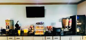 a counter top with food on top of it at Days Inn & Suites by Wyndham - Canton First Monday Trade Days in Canton