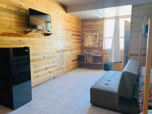 TV a/nebo společenská místnost v ubytování Rimusa Inn + 15 fotografií