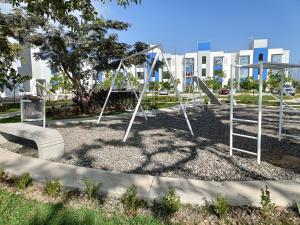 a park with a playground with a swing at Puerto Vallarta in Los Algodones