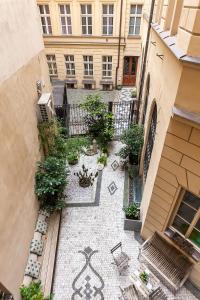 an overhead view of a courtyard in a building at Royal Apartment by Charles Bridge view of Saint Nicholas Church in Prague