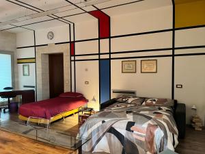 a bedroom with a large bed and a table at Casa & Bottega in Rivarolo Mantovano +6 photos