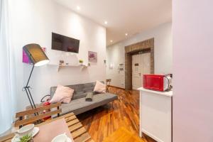 TV a/nebo společenská místnost v ubytování La Grande Bellezza Guest House Rome