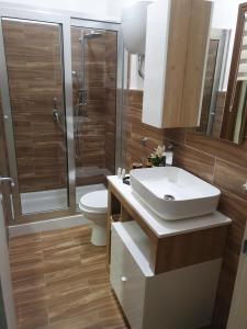 a bathroom with a sink and a toilet and a shower at My Dream House 386 in Angri