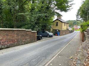 a car parked on the side of a road at Llangollen cosy apartment in Llangollen