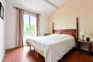 Posteľ alebo postele v izbe v ubytovaní Les Villas aux Restanques du Golfe de St Tropez - maeva Home - Villa 3 pièces 6 personnes vue parc - Sélection - Super Home MAE-8685 + 6 fotografií