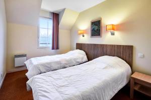 Posteľ alebo postele v izbe v ubytovaní Résidence Le Green Beach - maeva Home - 3 Pièces 6 Personnes Confort MAE-3005 + 10 fotografií
