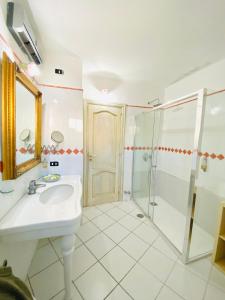 a bathroom with a sink and a shower at Casa Pippo 2 in Anacapri