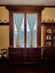a window with a dresser in front of a window at Mountain Home Bed & Breakfast in Front Royal