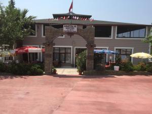 a building with an arch with a sign in front of it at Anatolia Hotel in Pamukkale