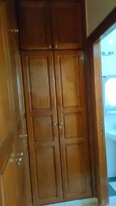 a pair of wooden cabinets in a room at Logement calme très proche du centre in Oujda