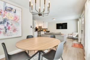 a dining room and living room with a table and chairs at Pet-Friendly Salt Lake City Getaway Near Skiing! in Salt Lake City