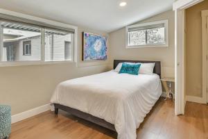 a bedroom with a bed and two windows at Pet-Friendly Salt Lake City Getaway Near Skiing! in Salt Lake City