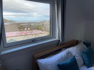 a window in a room with a view of a city at Hillside View, Inverness in Inverness