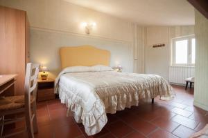 Кровать или кровати в номере La Finestra sul Lago