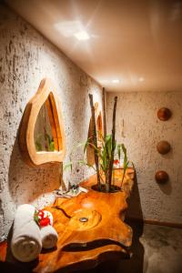 a bathroom with a sink with a plant in it at POUSADA ZAYA in São Miguel dos Milagres