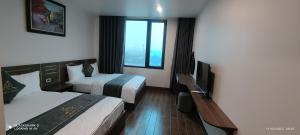 Postel nebo postele na pokoji v ubytování LS HOTEl