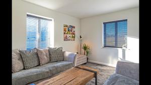 a living room with a couch and a coffee table at The Highfield Chester. in Chester