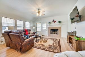 a living room with a couch and a fireplace at San Antonio Home with Game Room, 9 Mi to SeaWorld! in San Antonio