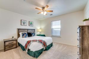 a bedroom with a bed and a ceiling fan at San Antonio Home with Game Room, 9 Mi to SeaWorld! in San Antonio