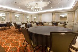a large room with a table and chairs at Drury Inn & Suites St. Louis Creve Coeur in Creve Coeur
