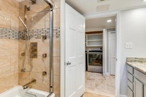 a bathroom with a shower and a sink at Spacious Home with Tranquil Patio about 29 Mi to DC! in Severn +34 photos