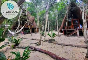 a tree house in the middle of the forest at 7 CIELOS BACALAR. in Bacalar