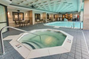 a jacuzzi tub in the middle of a building at Drury Inn & Suites Louisville East in Louisville