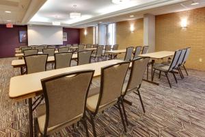 a room with rows of tables and chairs at Drury Inn & Suites Louisville East in Louisville