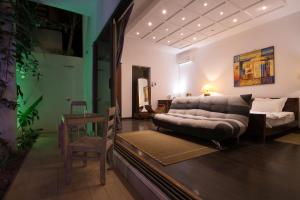 Un pat sau paturi într-o cameră la Villa Alizee