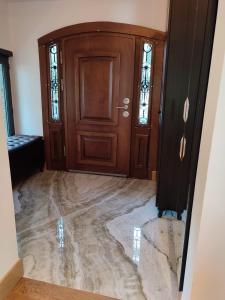 aoyer with a wooden door and a marble floor at Luxury villa in Istanbul