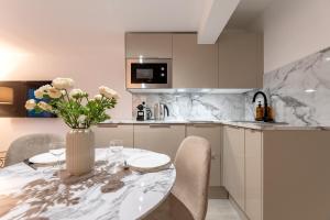 Η κουζίνα ή μικρή κουζίνα στο Villa Caron - Studios haut de gamme hyper centre +36 φωτογραφίες