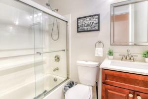 a bathroom with a shower and a toilet and a sink at Modern 3BR2BA Apartment Minutes to NYC in Jersey City