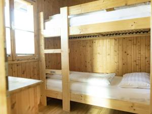 a bunk bed room with two bunk beds at Ferienhaus mit Weitblick in Pill