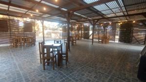 a restaurant with wooden tables and chairs in a room at Casona Pretton in Valparaíso