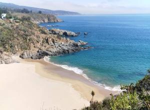 an aerial view of a beach next to the ocean at Casona Pretton in Valparaíso