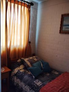 A bed or beds in a room at Casa en Villarrica