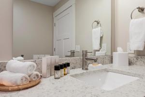 a bathroom counter with a sink and a mirror at 539 Bay St in Traverse City